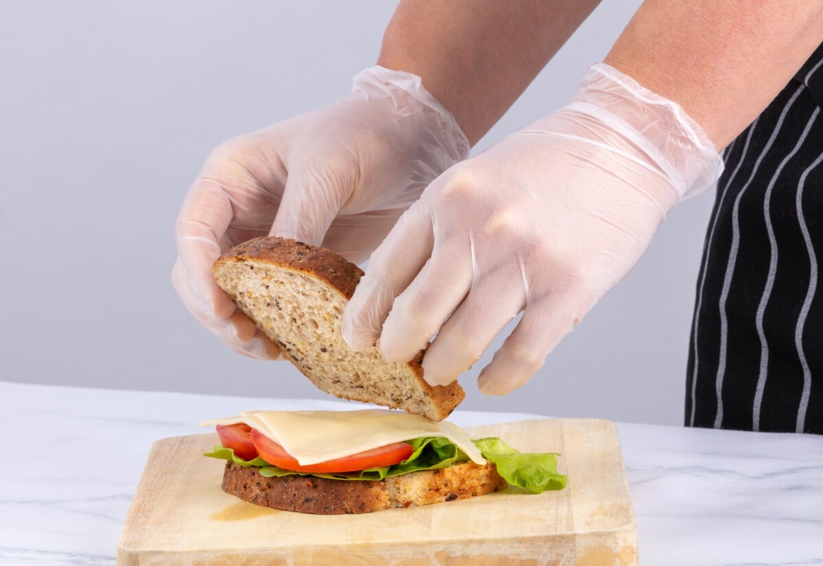 Gloves preparing sandwich