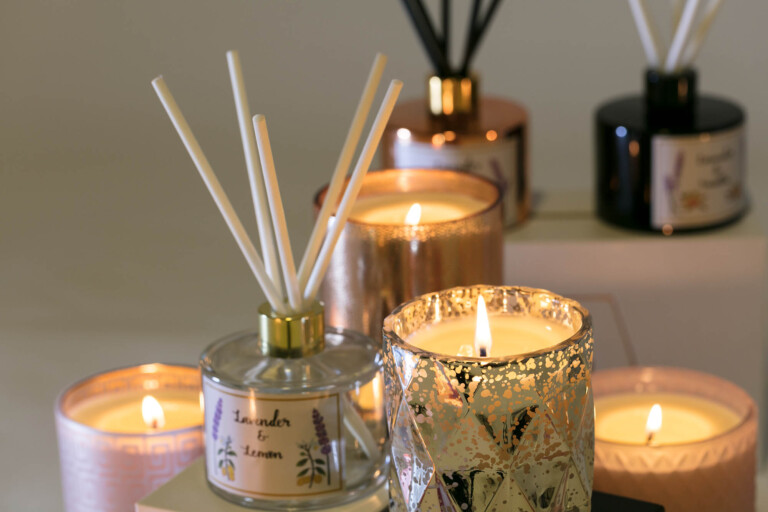 Product photography of diffusers and candles group lit afternoon look